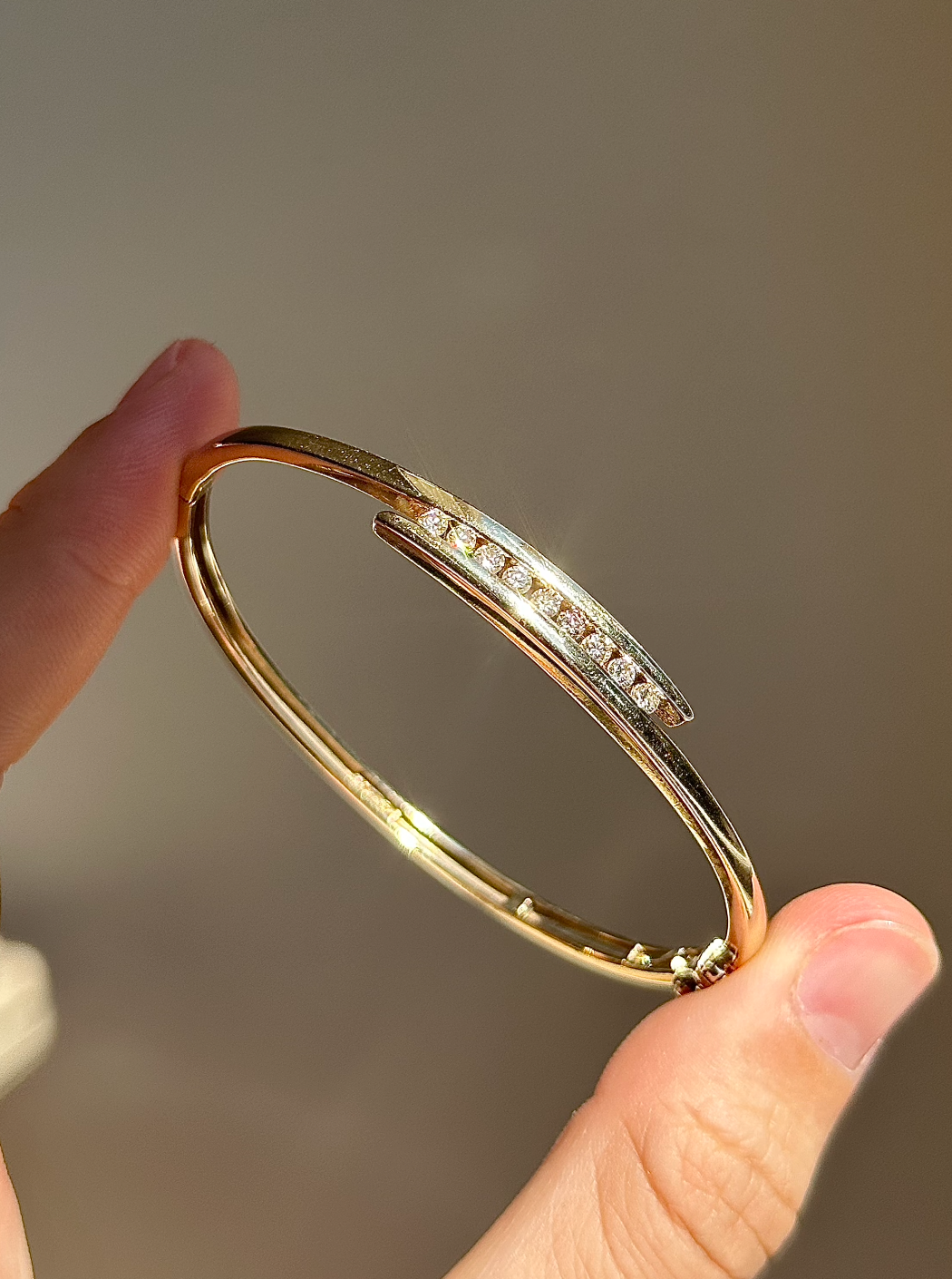 ESTATE 9CT GOLD AND DIAMOND BANGLE